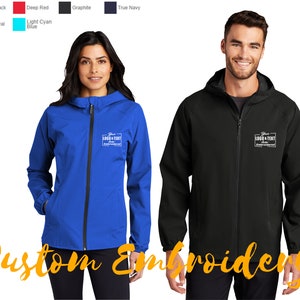 May include: Two people are wearing hooded jackets. The jacket on the left is blue and the jacket on the right is black. Both jackets have a white rectangle with the text "Your LOGO & TEXT Here" embroidered on the left chest.
