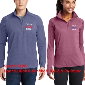 May include: A blue heather and a maroon heather Sport-Tek Sport-Wick Stretch 1/4-zip pullover. Each garment features a high collar, long sleeves, and a quarter-length zipper. The chest area displays the placeholder text YOUR LOGO HERE.