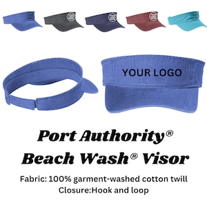 May include: A blue cotton twill visor with an adjustable hook and loop closure. The visor has the text "YOUR LOGO" embroidered on the front.