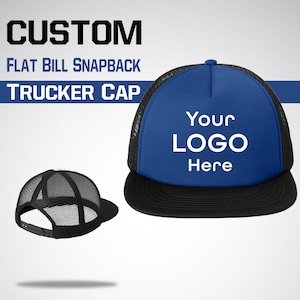May include: A blue and black trucker cap with a flat bill. The cap features a mesh back and a black brim. The front of the cap has the text "Your Logo Here" in white. The image also includes the text "CUSTOM FLAT BILL SNAPBACK TRUCKER CAP".