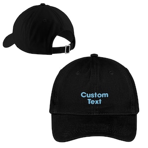 May include: Black baseball cap with a blue embroidered text that says "Custom Text".