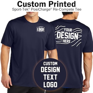 May include: A navy blue short-sleeved t-shirt with a white design on the front and back. The front design says "YOUR LOGO HERE" and the back design says "YOUR DESIGN HERE" with a wavy pattern. The text "CUSTOM DESIGN TEXT LOGO" is in a circle on the bottom of the image.