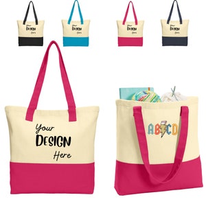 May include: A set of four tote bags with different colored handles. The bags are made of canvas and have a pink bottom. The bags are blank and ready to be customized with your own design. The text "Your Design Here" is printed on the front of the bag.