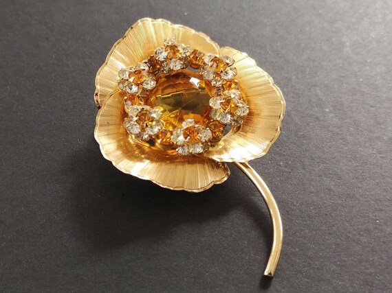 Hobe amber glass and rhinestone brooch.