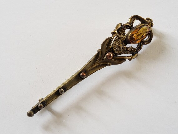A torch brooch with topaz glass stone - image 2