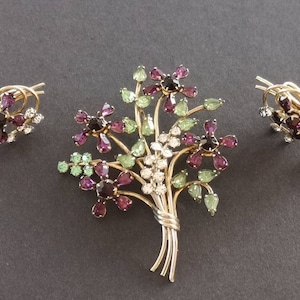 Designer signed Carl Art rhinestone earrings and brooch.