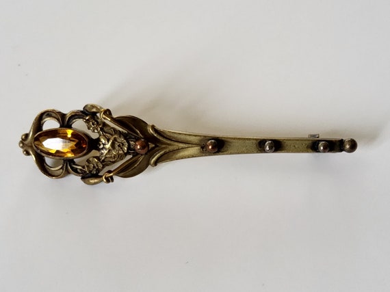 A torch brooch with topaz glass stone - image 4