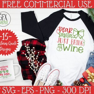 May include: A white and black raglan shirt with the text "Dear Santa Just Bring Wine" in red and green. The image includes a mug with the text "Christmas Music is My Jam", a red and black plaid scarf, and white sneakers.