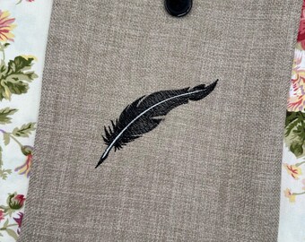 Fjäderbroderad bokomslag