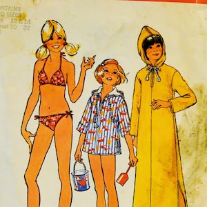 May include: A sewing pattern for a girl's swimsuit, a hooded jacket, and a beach cover-up. The pattern is from Simplicity and is number 6994. The pattern includes two sizes, 12 and 14, and requires a 76 to 81 cm bust.