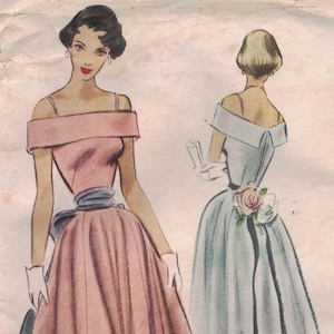 May include: Vintage McCall's sewing pattern for a Misses' Evening Dress, size 16. The illustration shows two elegant dresses: one in pink with a blue sash and the other in light blue with a floral accent. The pattern is printed on aged paper.