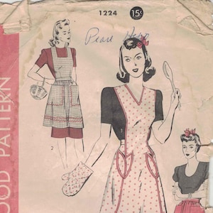 Op de afbeelding: Vintage naaipatroon met illustraties van schorten en een ovenwant. De schorten hebben verschillende ontwerpen, waaronder stippen en ruitpatronen. De tekst "HOLLYWOOD PATTERN" is zichtbaar aan de linkerkant van de afbeelding.