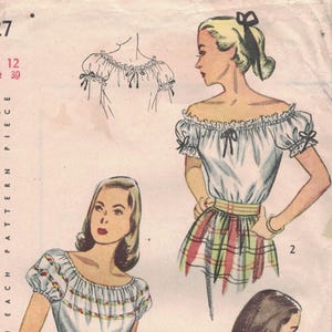 May include: Vintage Simplicity printed sewing pattern, size 12, featuring illustrations of off-the-shoulder blouses and skirts. The pattern includes a 25-cent price tag and the text "Simplicity is America's Fashion."