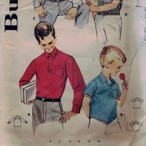 May include: A vintage sewing pattern for boys' shirts. The pattern includes four different shirt styles, with instructions for sizes 4 and 23 chest. The pattern number is 2164 and the price is 50 cents.