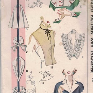 May include: Vintage McCall's printed sewing pattern featuring various collar and cuff designs. The illustration includes drawings of collars, cuffs, and a vestee, with a color palette of pink, white, and blue. The pattern is marked "1521" and includes the text "Printed Pattern with Transfer".