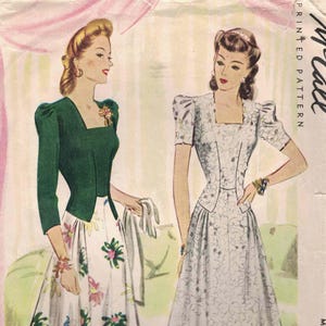 May include: A vintage McCall printed pattern envelope for a Misses' dinner dress. The illustration features two figures wearing floor-length dresses with square necklines, puff sleeves, and fitted bodices. One dress has a solid green top and a white skirt with colorful floral prints, while the other is a monochromatic floral pattern.