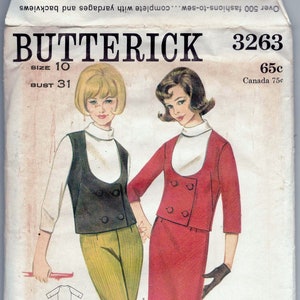 May include: Vintage Butterick sewing pattern envelope featuring illustrations of two women in 1960s fashions. The envelope includes the number 3263, size 10, and bust 31. The illustrations show a vest and pants outfit and a skirt suit.
