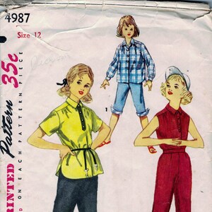 May include: Simplicity sewing pattern number 4987, size 12, for a 35c piece pattern. The pattern shows three girls wearing different outfits. One girl is wearing a yellow short-sleeved shirt with a black belt and dark blue shorts. Another girl is wearing a blue and white plaid shirt with blue shorts. The third girl is wearing a red sleeveless top with red shorts.