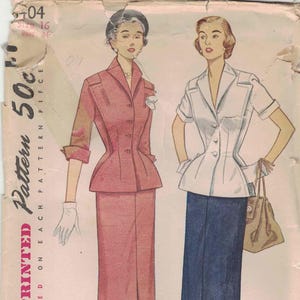 May include: Vintage Simplicity printed sewing pattern featuring two women's fashion designs. One model wears a pink suit, the other a white top and navy blue skirt. The pattern details are printed on each piece.
