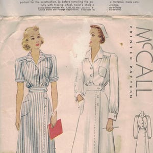May include: Vintage McCall's sewing pattern for a Nurses' Uniform, size 18. The pattern features illustrations of two different uniform styles, one with vertical stripes and the other in solid white. The pattern includes the text "Printed Pattern McCall".