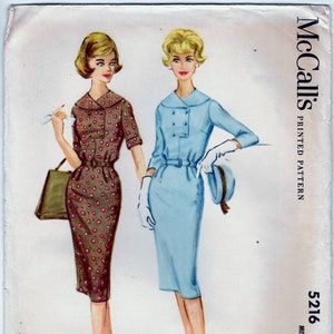 May include: Vintage McCall's sewing pattern featuring two dress designs. One dress is brown with a floral pattern, the other is light blue. The pattern number is 5216, size 14, bust 34 inches.