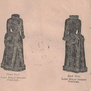 May include: A vintage paper featuring two illustrations of a long dress, labeled "Lady Dolls' Street Costume." One shows the front view, the other the back. The paper has a light pink hue and is slightly aged.