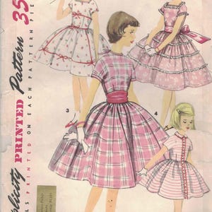 May include: Vintage Simplicity pattern 1707 for girls' dresses, featuring illustrations of various dress styles. The pattern includes a size 10 and is adaptable for chubby sizes. The price is 35 cents. The text "Simple to Make" is also visible.