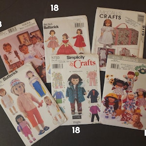 May include: A collection of vintage doll sewing patterns. The patterns feature illustrations of dolls in various outfits, including dresses, coats, and accessories. Brands include Butterick, Simplicity, and McCall's.