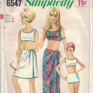 May include: Vintage Simplicity sewing pattern envelope featuring illustrations of three women in swimwear. The envelope is labeled "6547 Simplicity" and includes the size "16" and bust size "36". The design includes a skirt, shorts, and a two-piece swimsuit.
