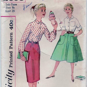 May include: Vintage Simplicity sewing pattern for a sub-teen girl's outfit. The pattern includes a white blouse with red polka dots and a green skirt with pockets. The pattern number is 2598 and the price is 40 cents.