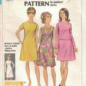 May include: Simplicity sewing pattern number 7507 for a junior size 15 dress. The pattern includes three different dress styles: a yellow sleeveless dress, a floral print sleeveless dress, and a pink long-sleeved dress. The pattern is labeled "Bonus Basic Pattern in Juniors' Sizes".