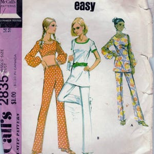 May include: A vintage sewing pattern for a women's coordinated separates outfit. The pattern includes a top, pants, and a skirt. The pattern is from McCall's and is labeled "easy".