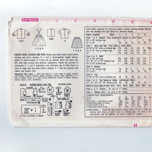 May include: A vintage sewing pattern for a child's skirt, blouses, and tops. The pattern includes instructions for making a skirt, three different blouses, and a top. The pattern is for sizes 2-6. The pattern is printed on white paper with black ink. The pattern includes a chart with fabric requirements for each size.