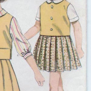 May include: A vintage illustration of two girls wearing matching yellow and brown dresses with white collars. The girl on the right has a short, blonde bob hairstyle and is wearing white socks and black shoes. The girl on the left has long, dark hair and is wearing a striped shirt. The illustration is from a vintage sewing pattern.