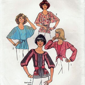 May include: Simplicity sewing pattern number 7931 for a blouse with a scarf print fabric. The pattern includes three different styles of blouses with different sleeve lengths and necklines. The pattern is for size 10 miss.