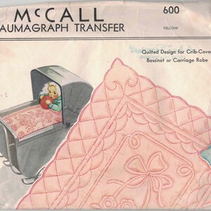 May include: A McCall Kaumagraph Transfer pattern envelope number 600 for a quilted design for a crib cover, bassinet, or carriage robe. The packaging features a graphic of a baby in a carriage and a pink quilted blanket with a bow design.