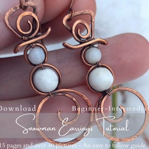 May include: A pair of copper wire snowman earrings with white beads. The earrings are handmade and have a hammered texture. The earrings are shown in a close-up image with the text "PDF Download Beginner-Intermediate Level Snowman Earrings Tutorial 15 pages and over 40 pictures - An easy to follow guide".