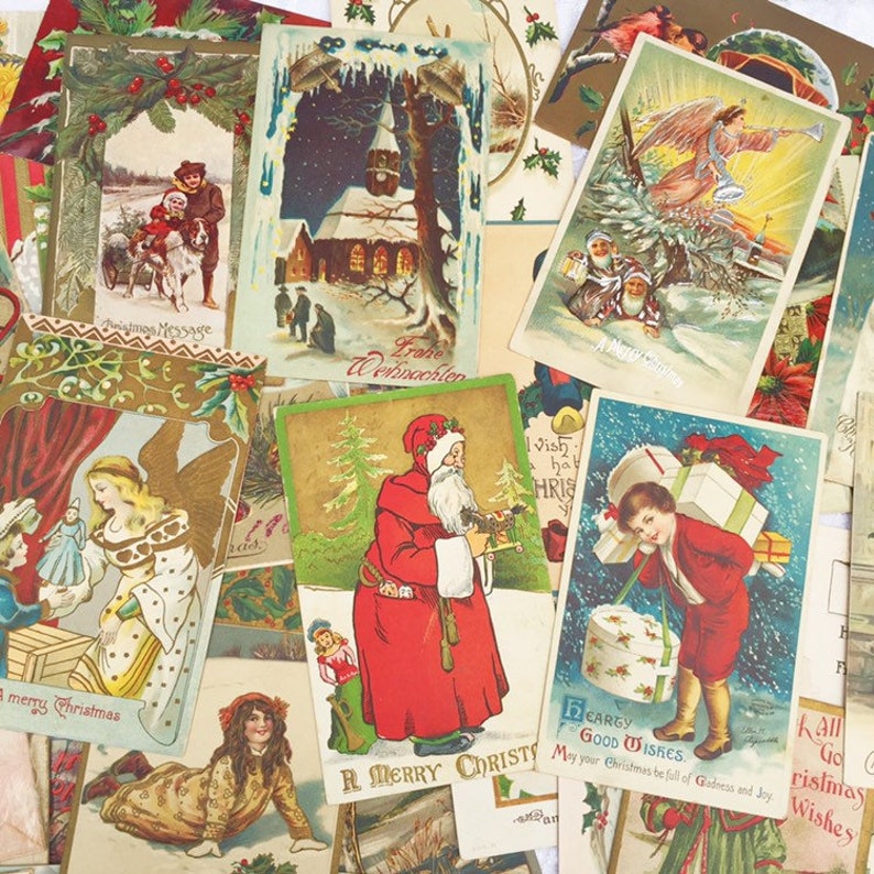 May include: A collection of vintage Christmas postcards featuring various festive scenes, including Father Christmas, angels, and winter landscapes. The postcards are printed on thick paper with colourful illustrations and gold accents.