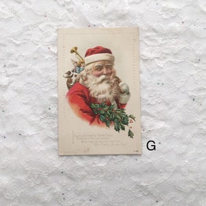 May include: Vintage Christmas postcard featuring a jolly Santa Claus with a white beard and red suit. He is carrying a bag of toys on his back and a small white ball in his hand. The postcard has a holly border and the text "It's almost time for Santa Claus To start on his big sleigh And may he for surely visit you On Merry Xmas Day."