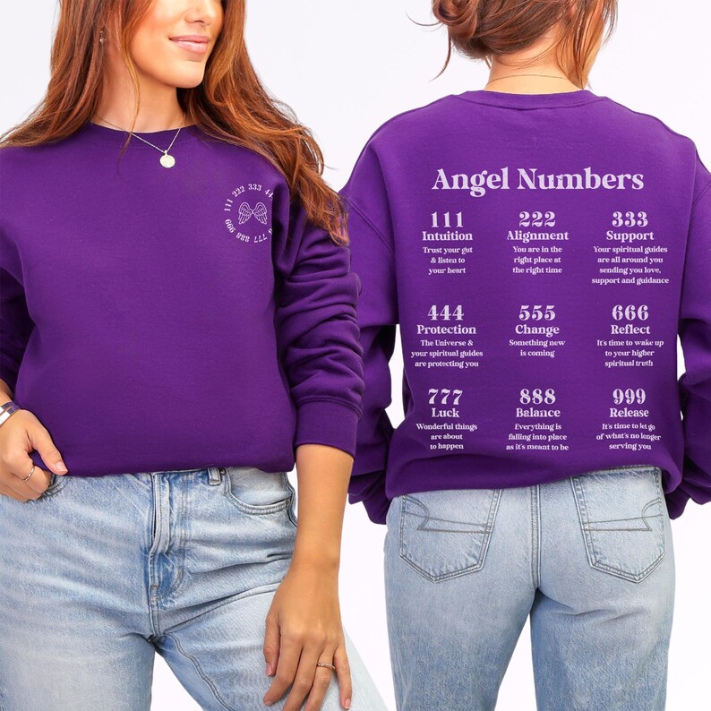 May include: A purple sweatshirt with the words "Angel Numbers" printed on the back. The sweatshirt features a list of angel numbers and their meanings. The front of the sweatshirt has a small design with the numbers 222, 333, and 444.
