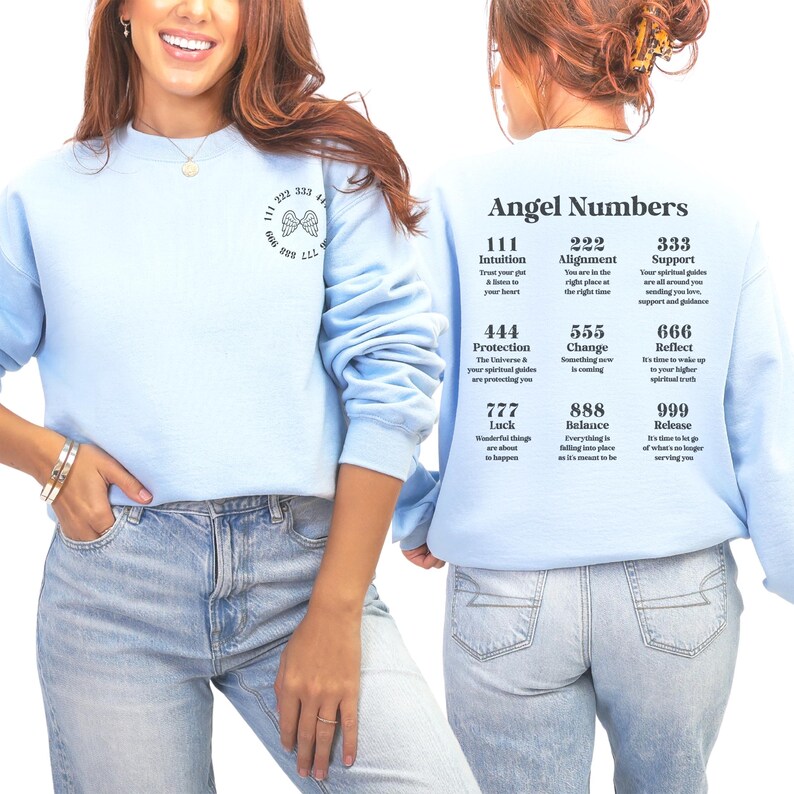 May include: Light blue sweatshirt with the text "Angel Numbers" on the back, along with a list of numbers and their meanings. The front of the sweatshirt has a small graphic of angel wings and numbers.