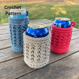 May include: Three crocheted can coolers in different colors. The coolers are made with a simple stitch pattern and are perfect for keeping drinks cold. The colors are blue, beige, and red.