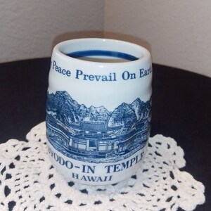 Byodo In Temple Hawaii  May peace prevail on Earth Blue white souvenir cup