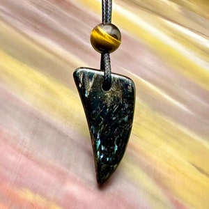 May include: A white ceramic mug with a black handle and the text "But First, Coffee" in a black, bold font. The mug is on a white surface.