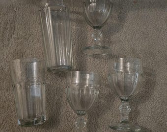 1 large glass and 1 medium glass Drinking and3 water goblets