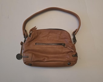 This is a bag from The Wanderers Travel Co. Hand bag