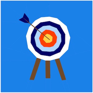 May include: A white archery target with blue, light blue, orange, and yellow rings. An arrow is in the center of the target. The target is on a brown tripod stand.