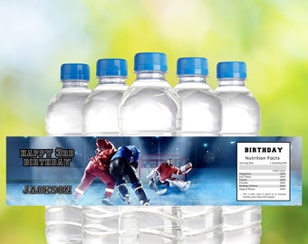 May include: Water bottle labels with a hockey theme. The label features a hockey player and goalie on the ice. The text on the label reads "Happy 3rd Birthday Jackson".