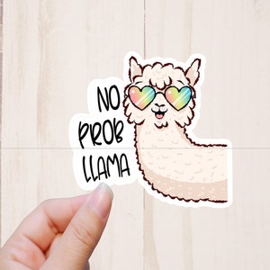 May include: A white llama wearing rainbow heart-shaped sunglasses with the text "No Prob Llama" in black lettering.