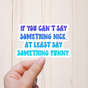 May include: A sticker with a blue and purple gradient that says "If you can't say something nice, at least say something funny."